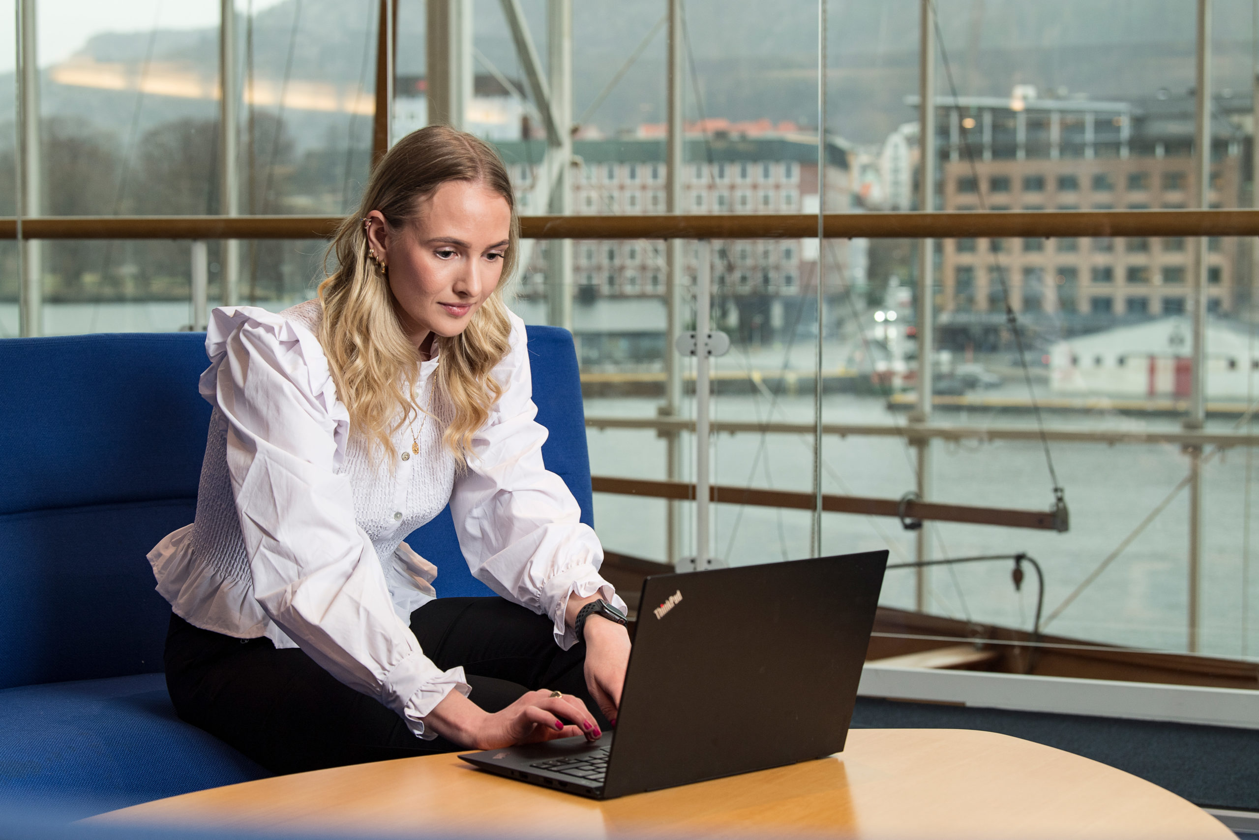 Marit Eiken Fosse works on her computer at the headquarter of Grieg Group in Bergen.