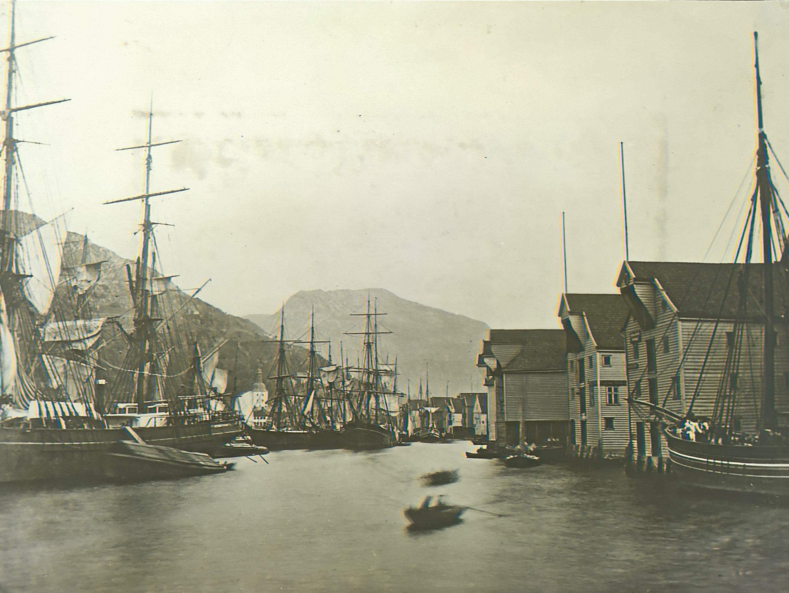 Sailboats connected to Grieg on the ocean in Bergen over 100 years ago. Historical black and white.